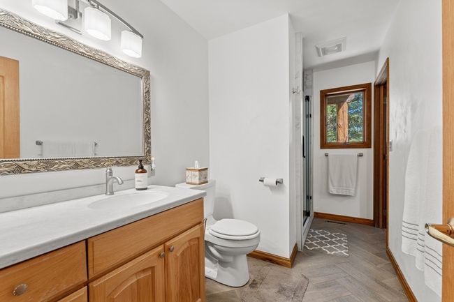 Main floor bath with large updated shower. | Image 49