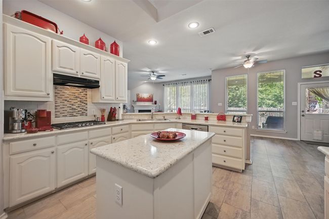This kitchen is a dream for the person who wants an open kitchen. Not only is this kitchen open to the rest of the house, but it also includes a gas cooktop, a big upgrade from the standard electric that many homeowners are accustomed to. Plus, it has quartz countertops, a feature that’s highly coveted by those with a passion for cooking. | Image 11