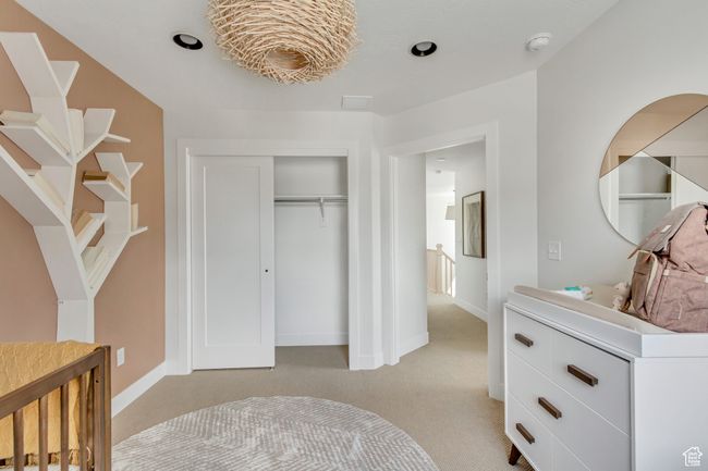 Bedroom with light carpet and a closet | Image 20