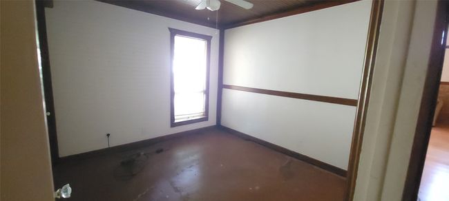 Spare room with concrete floors and a ceiling fan | Image 13