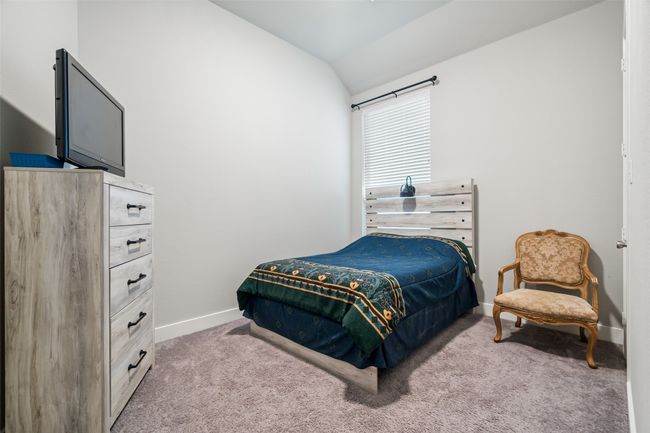 Carpeted bedroom featuring vaulted ceiling, custom blinds | Image 12