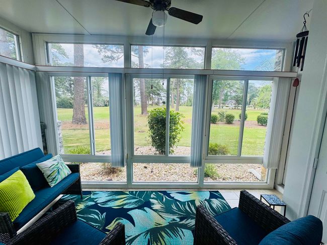 Sunroom with a ceiling fan | Image 5