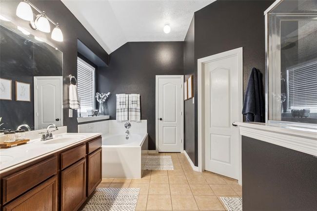 Spacious primary bath offer double sinks, soaking tub and separate shower. | Image 15