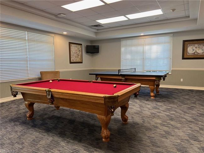 Game room with dark carpet, pool table, and a paneled ceiling | Image 34