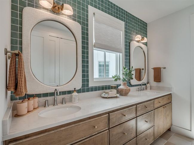 Full bath with double vanity and tile patterned floors | Image 24