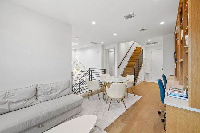 Living area featuring recessed lighting, light wood-type flooring, and stairway | Image 22