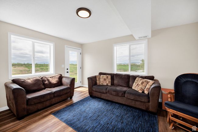Basement Living area with wood finished floors | Image 18