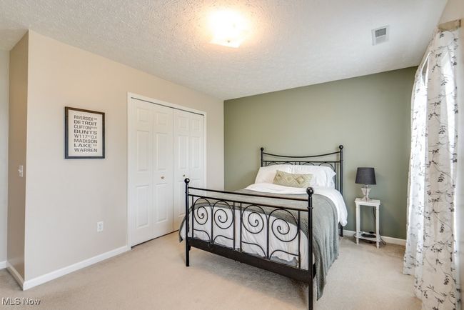 Carpeted bedroom featuring a closet and baseboards | Image 31