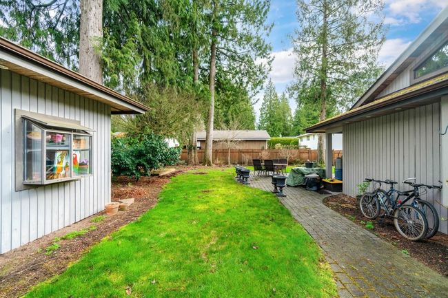 View of yard featuring a patio and fence | Image 34