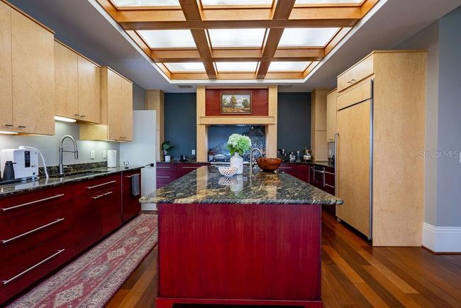 The kitchen is thoughtfully designed with a layout that maximizes efficiency and funtionality for everyday cooking and entertaining | Image 22