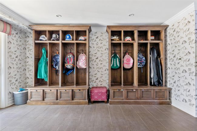 Mudroom with wallpapered walls, baseboards, and wood finish floors | Image 24