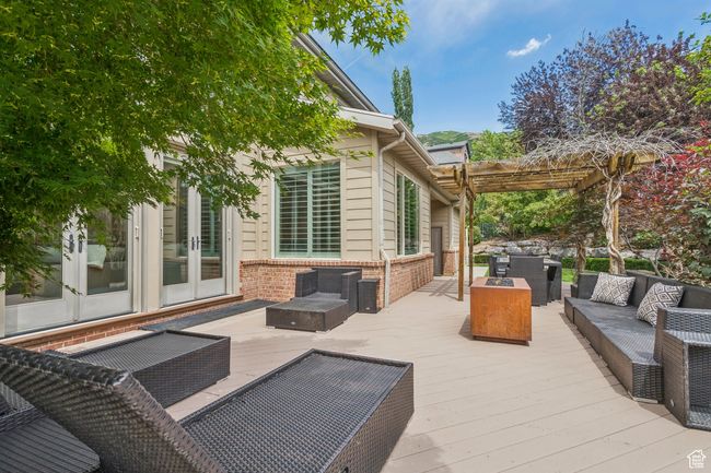 Deck featuring french doors, an outdoor hangout area, and a pergola | Image 78