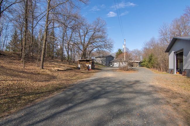 A longer driveway adds to the private oasis | Image 49