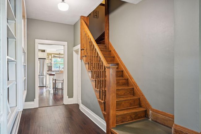 Here, you get an up-close view of the rear staircase and the built-in shelving peaking on the opposite wall. | Image 10