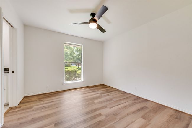 bedroom with jack & Jill bath featuring light wood-type flooring and ceiling | Image 24