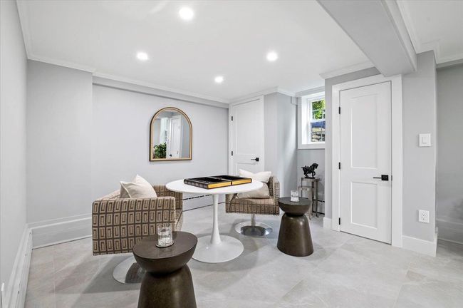 Sitting room with ornamental molding and recessed lighting | Image 29