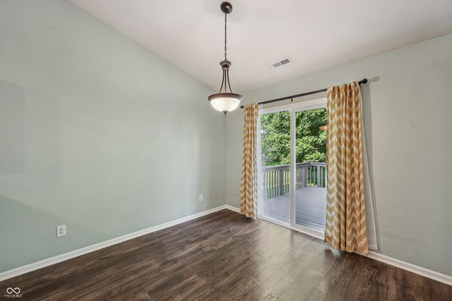 empty room with dark wood-type flooring and baseboards | Image 9