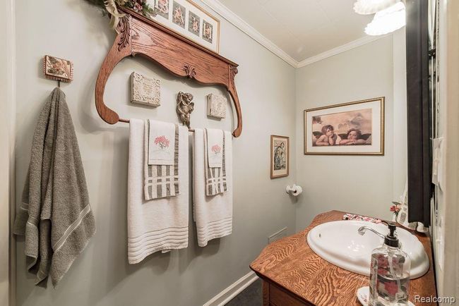 Full bathroom with crown molding | Image 32