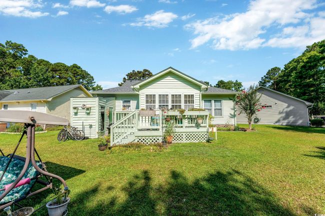 Back of house featuring a lawn and a wooden deck | Image 20