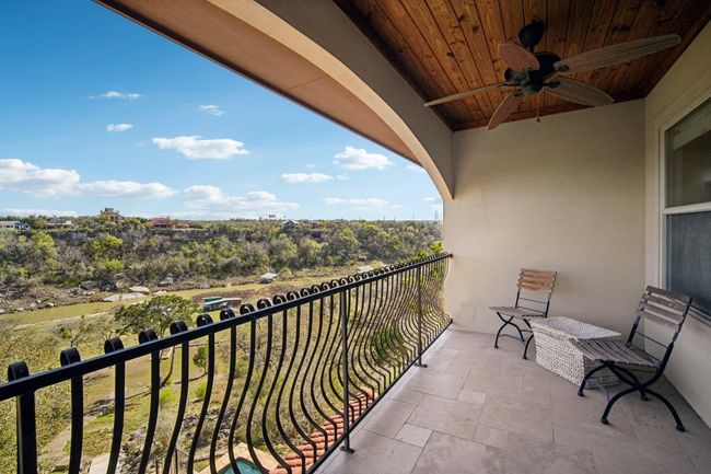 Balcony featuring ceiling fan | Image 21