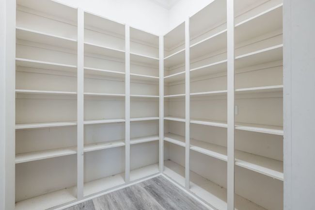 View of walk-in pantry. | Image 14