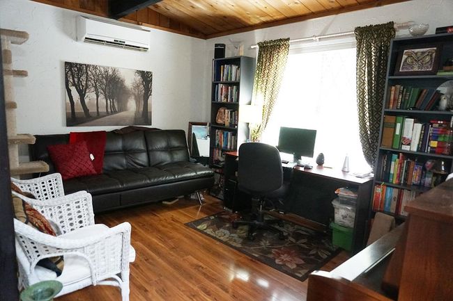 Office featuring lofted ceiling, wood ceiling, wood finished floors, and a wall mounted AC | Image 17