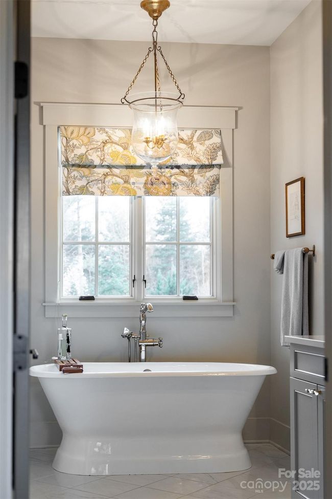 Relax in the beautiful soaking tub in the primary suite. | Image 12