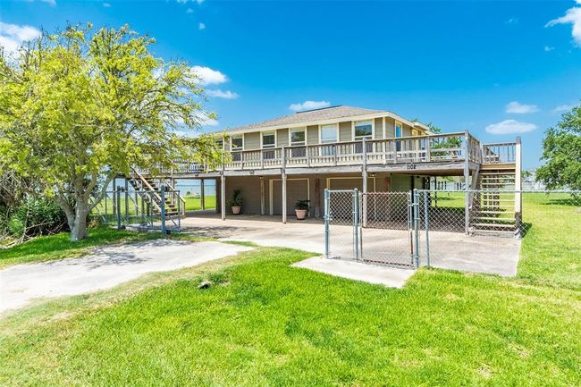 1.5 car garage below with carport and extra parking space | Image 5