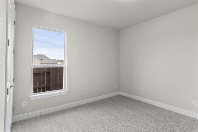Carpeted spare room with baseboards | Image 16