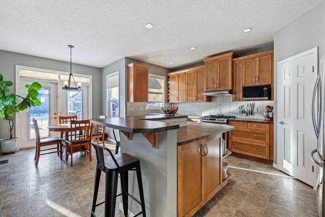 716 Boulder Creek Drive Se, House other with 4 bedrooms, 4 bathrooms and 4 parking in Langdon AB | Image 8