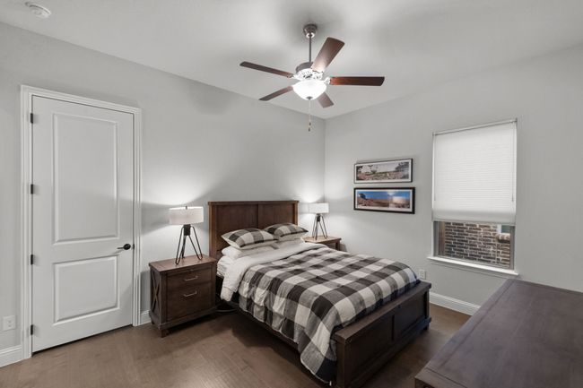 Secondary bedroom with wood flooring, and ceiling fan | Image 29