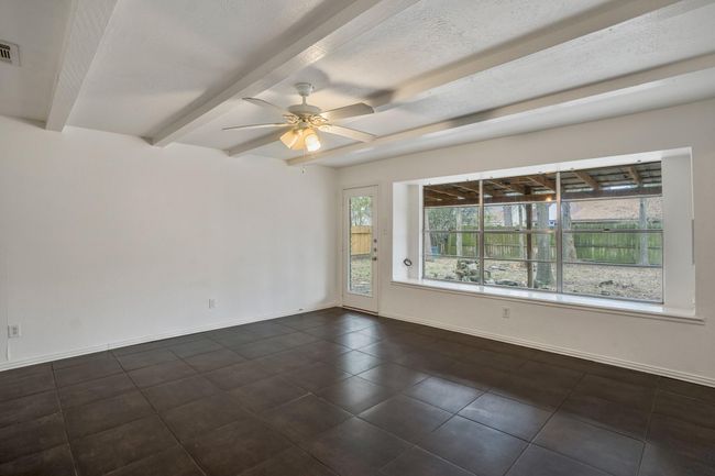 Admire the wall of windows providing abundant natural light | Image 4