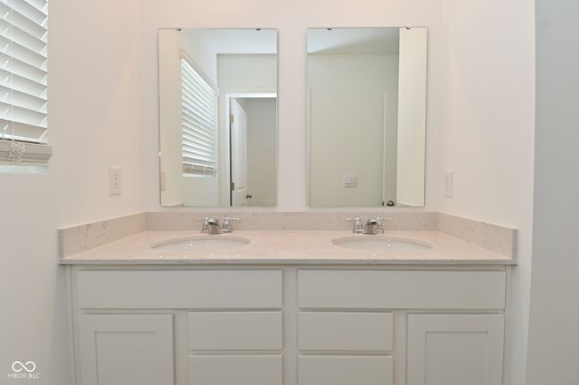 full bathroom featuring double vanity | Image 42
