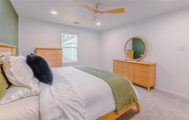 Another view point in the primary bedroom shows that you have plenty of room for your king sized bed and more. | Image 16