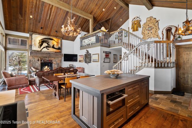 Living room view from the open kitchen overlooking the island. | Image 8