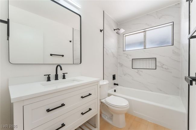 Bathroom featuring vanity and shower / tub combination | Image 48