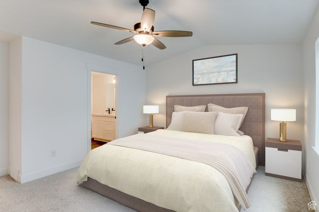 Carpeted bedroom with baseboards, ensuite bathroom, a ceiling fan, and vaulted ceiling | Image 6