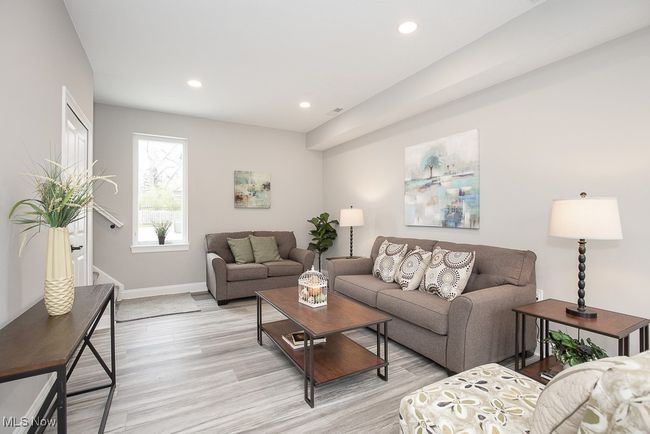 Living room with light hardwood / wood-style floors | Image 10