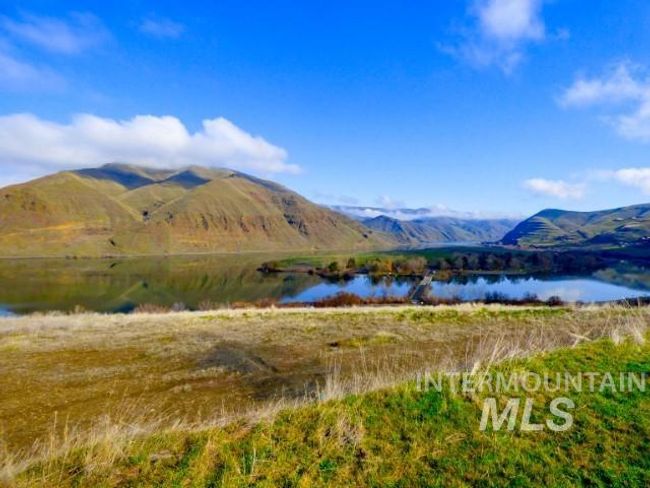View of mountain backdrop with a nearby body of water | Image 38