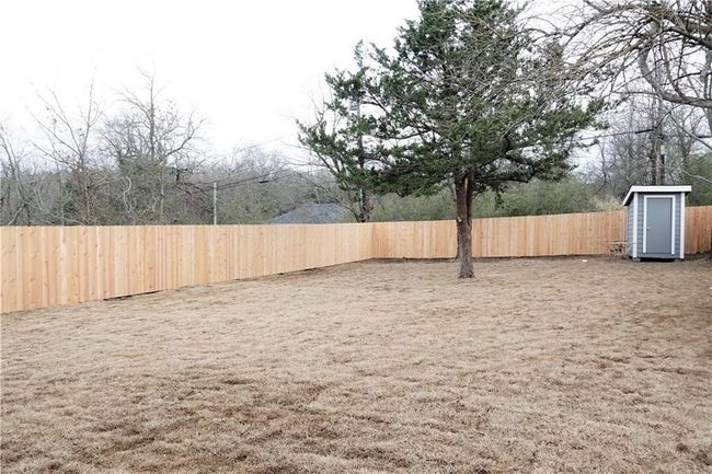View of fenced backyard | Image 20