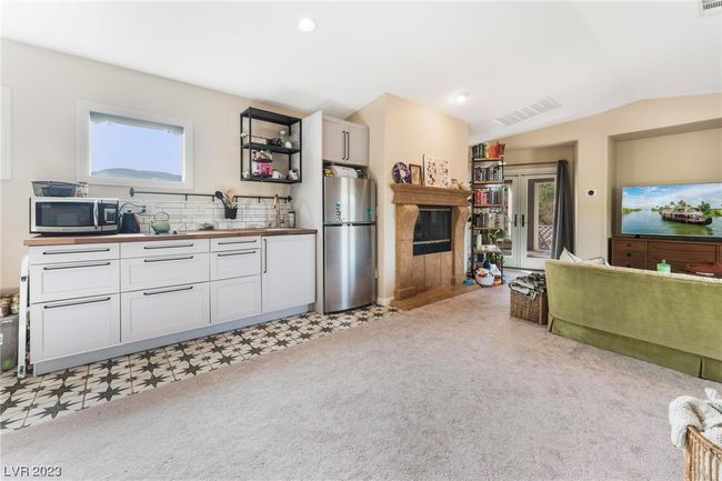 Casita with brand new kitchen, fireplace, full bathroom to the right of the TV area. | Image 23