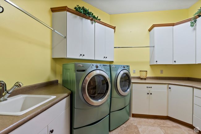 Laundry area with cabinet space and washing machine and dryer | Image 42