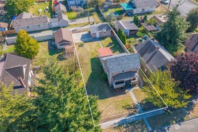 Plat of home's property shown with a white line. Note alley to rear for garage entrance. Fully fenced yard. | Image 3