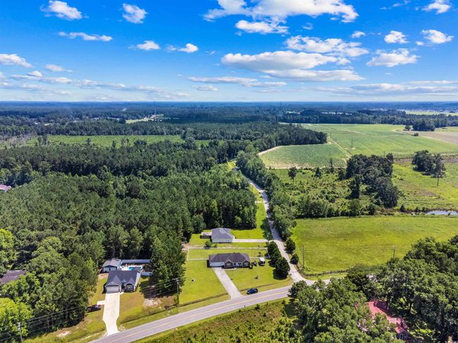 Aerial view of a heavily wooded area | Image 24