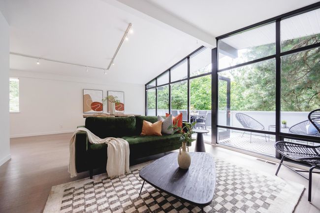Living room with rail lighting, light wood-type flooring, and vaulted ceiling | Image 11
