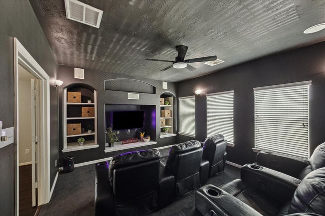 Movie Night! Enjoy your favorite movies and games in this inviting media room. New paint and new carpet were installed in May 2025, new fan 2/2024. This room could be a 6th bedroom if needed. | Image 39