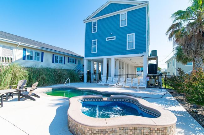View of pool with a patio area, an in-ground hot tub, and fence | Image 10