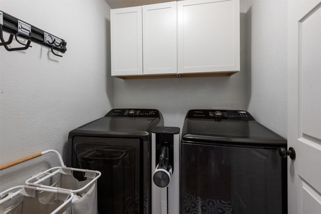 Laundry area with cabinet space and washer and clothes dryer | Image 20