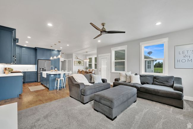 Living area featuring a ceiling fan, recessed lighting, and light wood-type flooring | Image 17