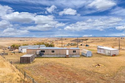 Back of property with a rural view and an outdoor structure | Image 2